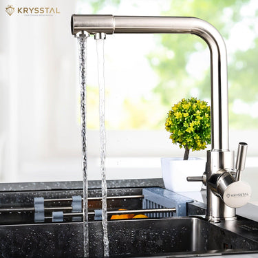 Silver-colored kitchen faucet set with an extra filtered water tap, shows while water flowing in 2 different way on transparent backdrop.