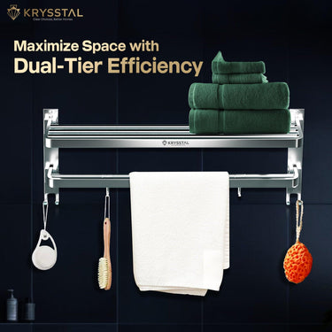 An SS towel rack fixed on a black wall, with a green towel put on the upper rack and other things hanging on a lower rack.
