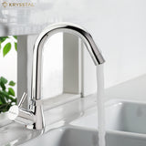 A silver kitchen sink tap with a high arch and a lever handle, dispensing water into a sink.