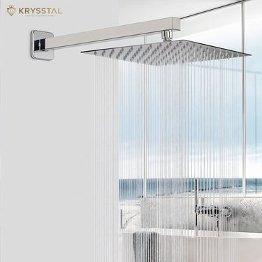 A silver color overhead rain shower with straight water flowing from it fitted on a white background wall