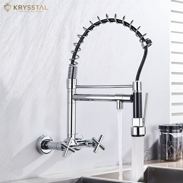 Chrome kitchen faucet with pull-down sprayer with dual controller fitted on a white wall, featuring the Krysstal brand.