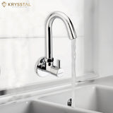Krysstal brand wall-mount faucet in a reflective chrome finish with a graceful arc and a single jet of water flowing out.