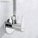 A chrome angle valve with a polished metallic surface and a fitted pipe on an upper hole and fitted on a white wall.
