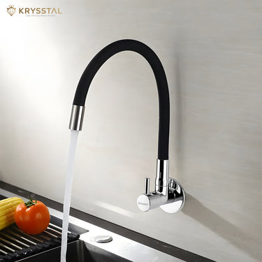 Flexiflow silicone spout kitchen mixer in chrome, wall-mounted, showing water flow and adjustable settings with veggies tray on the left bottom.