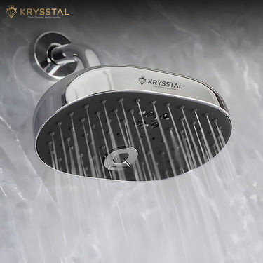 Durable ABS body with Chrome Overhead Rain Shower with Shower Arm (6") & Flange fitted on grey wall with water flowing.