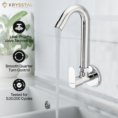 A chrome swan-neck faucet pouring water into the white sink basin with its features on the left side on a faded white background.