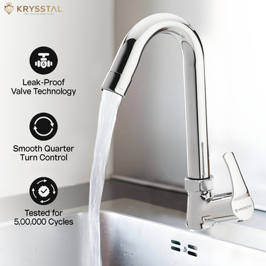 A silver kitchen sink tap with water flowing through it, highlighting features such as leak-proof valve technology, smooth quarter turn control, and durability through numerous cycles.