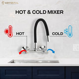 A wall-mounted kitchen sink mixer tap with a flexible silicone spout and chrome finish with dual controller system like "Hot & Cold", fitted on a white tile wall.