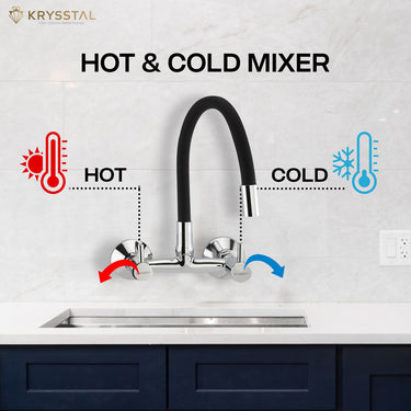A wall-mounted kitchen sink mixer tap with a flexible silicone spout and chrome finish with dual controller system like "Hot & Cold", fitted on a white tile wall.