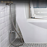 A hanging view of flexible tube shower beside the white toilet sheet fitted on the glossy tiles