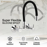 Dual-control chrome kitchen mixer tap with a Super flexible spout in a zig-zag shows on the backdrop, mounted on the wall above the sink with 3 features on the bottom.