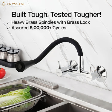 Flexible silicone kitchen tap in chrome showing "Built Tough, Tested Tougher" on the top, mounted on the wall, with two flow options with SS sink & vegetable tray on the bottom.