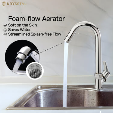 A chrome faucet with a paddle handle, set against a blurry kitchen backdrop, marketed with the key mechanical feature & foam flow aerator.