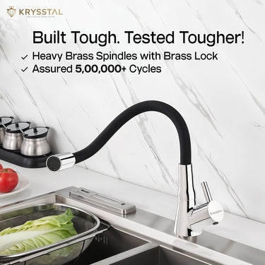 A table-mounted kitchen sink tap with a silicone spout fitted on a white slab, featuring a built tough & tested tougher technology