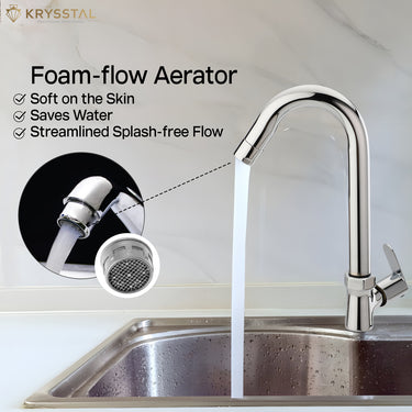 A stream of water flowing from a contemporary chrome kitchen faucet with foam flow aerator features is shown in the zoomed image.