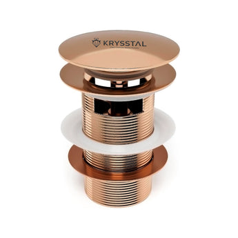 Rose gold-colored drain plug with Krysstal logo on a white background