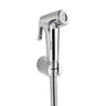 A silver health faucet with a flexible shower tube and wall hook.