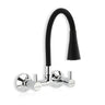 A wall-mounted kitchen sink mixer tap with a flexible silicone spout and dual flow settings, finished in chrome.
