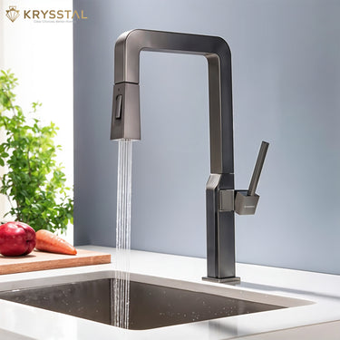 Modern kitchen faucet with water flowing into a sink, Krysstal brand visible on a light blue background