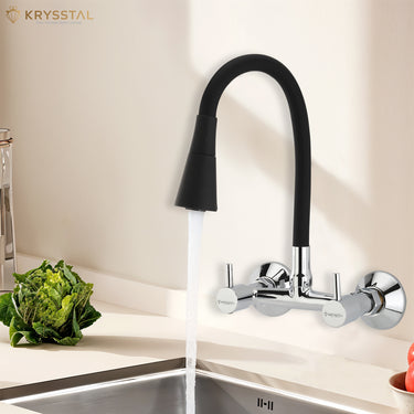 Flexible silicone spout kitchen mixer in chrome, wall-mounted, showing water flow and adjustable settings.