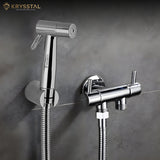 Chrome bathroom faucet and shower head set against a gray wall with Krysstal branding.