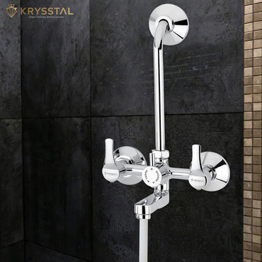 Chrome-plated brass wall mixer tap with two handles and a curved spout, designed for dual water fixed on the black wall.