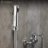 Chrome shower head and hose mounted on a tiled wall with on right bottom shows the SS fittings