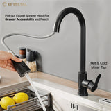 Black kitchen tap with round rotating spout and handle with hand-held pulled out features with flowing water & Hot & Cold Mixer Tap fitted on a kitchen slab against a beige background.