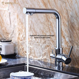 A chrome finish kitchen faucet set with an extra filtered water tap with water flowing on a sink bowl, on a brown textured backdrop.