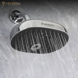 Durable ABS body with Chrome Overhead Rain Shower with Shower Arm (6") & Flange fitted on grey wall with water flowing.