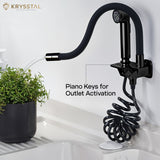 A black faucet with a hand shower attachment is shown while watering the pot, and there is a piano design on a white background.