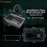The dimensions of the kitchen sink in stainless steel with a minimalist faucet and the "AquaStation Piano & Smart Kitchen Sink" tagline with its sizes in inches on a green background.
