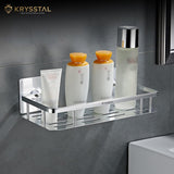 Medium silver wall shelf tray with face wash, two shampoos, and one deodorant on a grey wall.