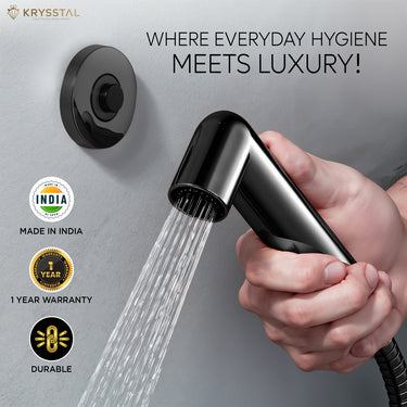 Black magnetic ABS health faucet with handheld sprayer and flexible shower tube, showing magnetic wall-mount connection.