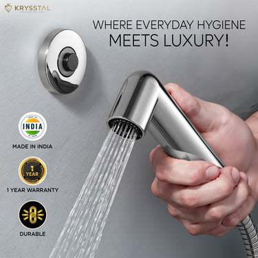 Handheld shower head with water flowing, held by a hand, against a gray background with Krysstal branding and product features.