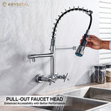 A silver hand-held pull-out faucet head with dual controller in a kitchen setting with water flowing.