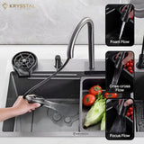 Stainless steel sink combining a handheld faucet with water spraying and a vegetable tray over a white tiled base.
