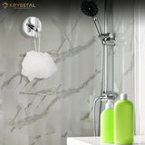 A round-base silver wall hook with upright bar, mounted on grey wall, supporting white scrub beside two green soap dispensers and SS showers.