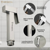 Krysstal shower head with features highlighted on a tiled bathroom wall background