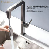 Krysstal foam-flow aerator faucet in a kitchen setting with water flowing.