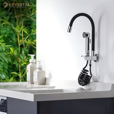 Black flexible kitchen faucet with dual flow and detachable hand shower, isolated on white wall above the sink beside the 2 dispenser.