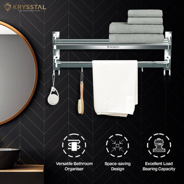 A silver towel rack fixed on a black wall with a white texture, with a right-side half-round mirror & at the bottom showing 3 features.