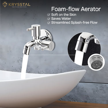 Dual-purpose chrome wall-mounted tap with two cylindrical handles controlled with a foam flow aerator feature.