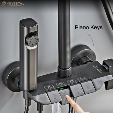 Matte black shower control panel with piano key design, featuring rain shower and handheld shower on a gray background.