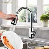 A silver-colored faucet aerator with hand-held pulling features is shows while washing the plate. in a kitchen setting.