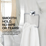 A white towel on the silver SS towel square ring with a square mounting on the wall & tag line written on the left side on a mirrored background.
