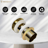 Gold drain plug with Krysstal branding and feature icons on the top on a white background
