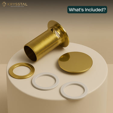 Golden pop-up components, including a drain, washer, and gasket on a beige surface.