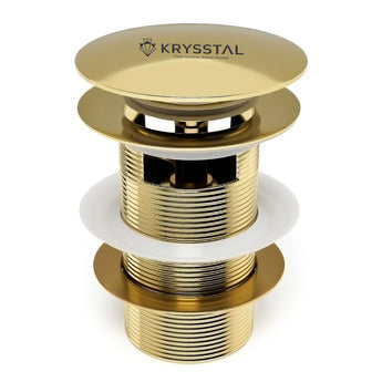 Gold bathroom drain stopper with Krysstal logo on a white background